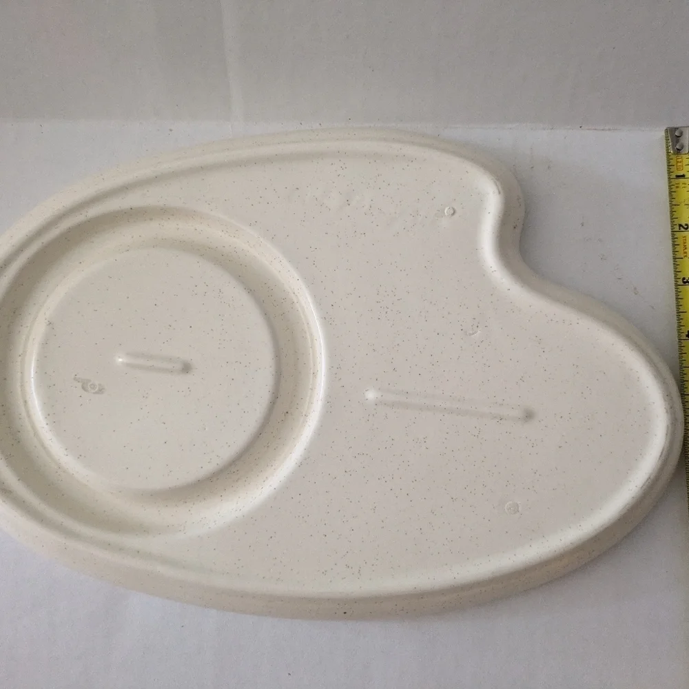Retro speckled ceramic platter chip and dip.